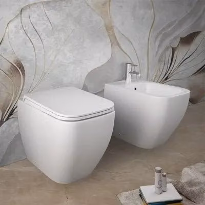 Sanitari filomuro Rak serie Metropolitan in ceramica bianco opaco con tecnologia Rimless e copriwcata soft-close L: 52,5 cm, P: 40,0 cm, H: 33,7 cm