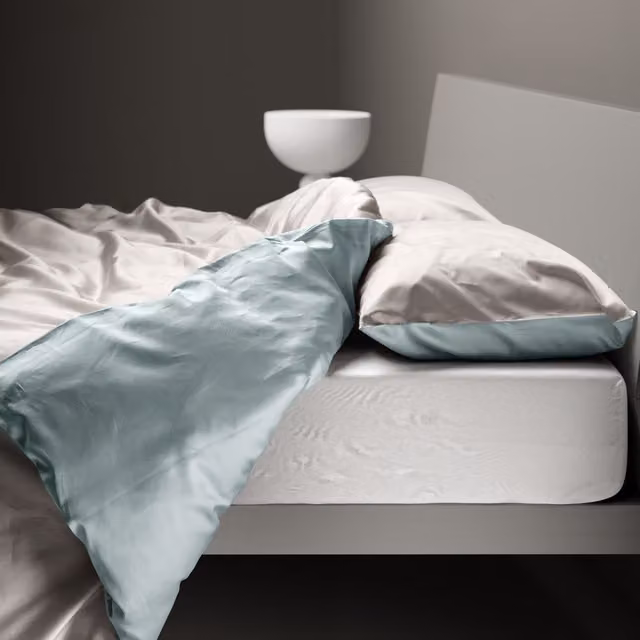 Copripiumino reversibile DaunenStep Oasi Kiss in cotone Mako Satin blu con chiusura a zip