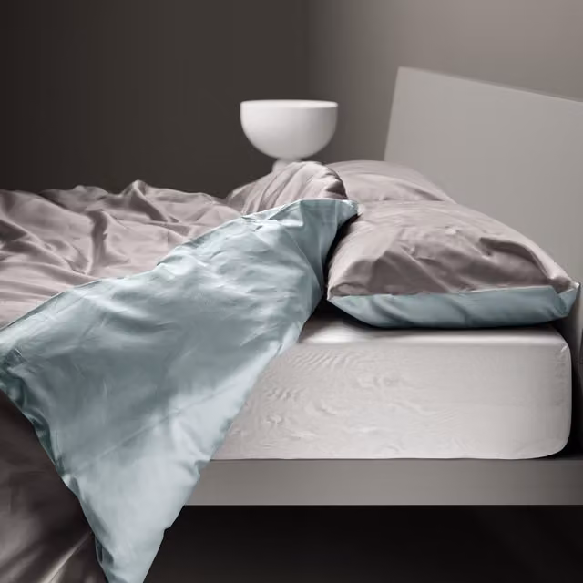 Copripiumino reversibile DaunenStep Oasi Kiss in cotone Mako Satin grigio con chiusura a zip